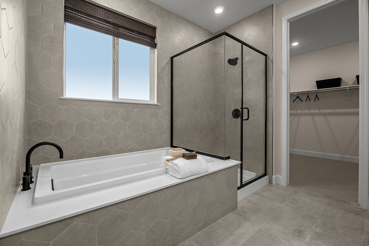 Soaking tub and separate walk-in shower at primary bath