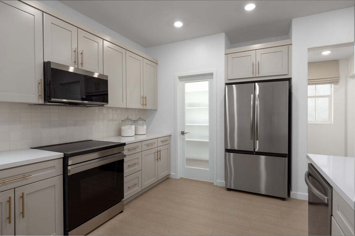 Walk-in kitchen pantry with reeded glass door