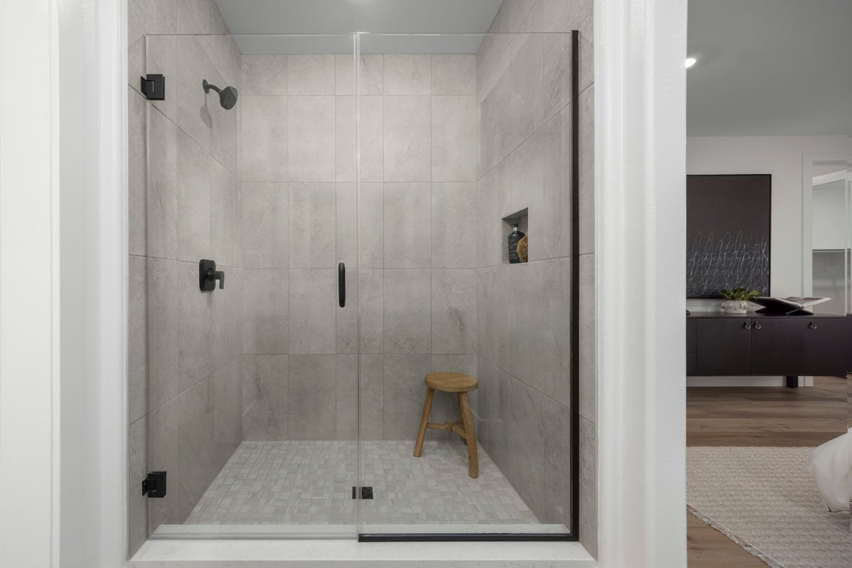 Walk-in shower with tile surround at primary bath