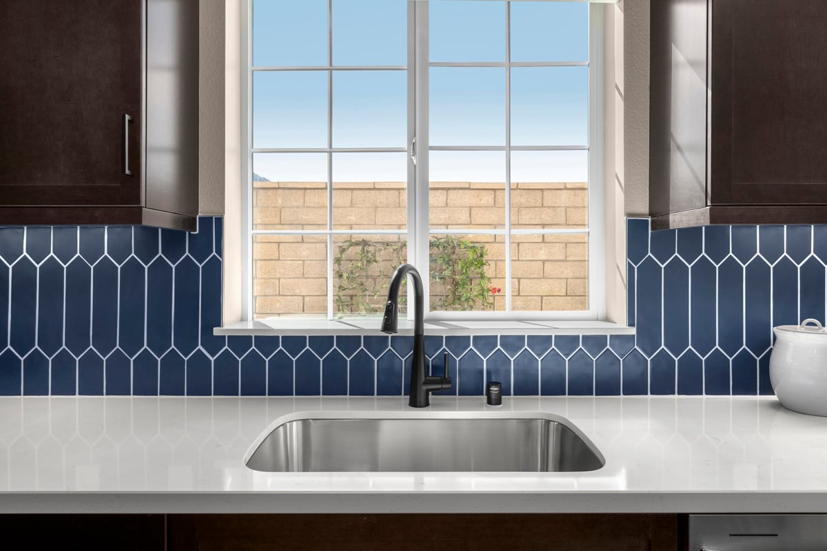 Optional quartz countertops and custom tile backsplash 