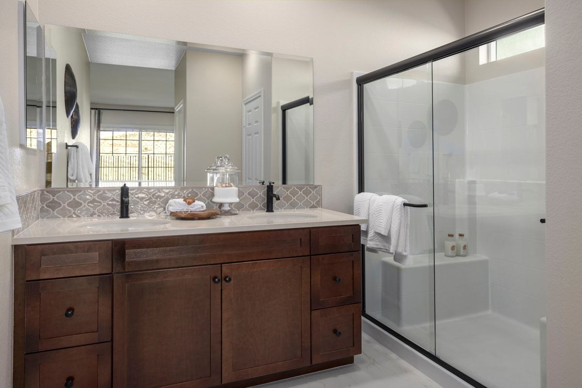 Shower with optional black frame enclosure at primary bath