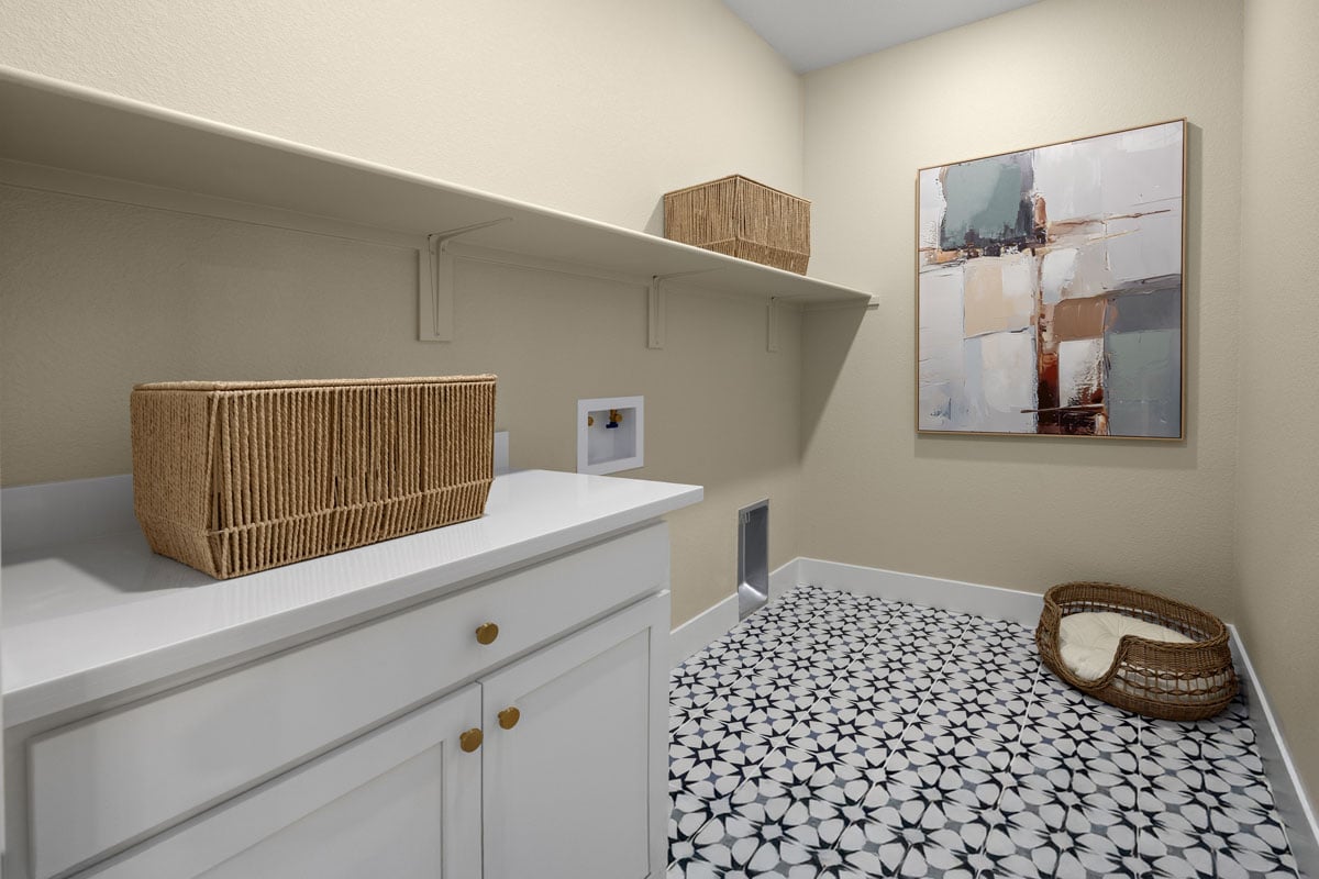 Spacious laundry room with storage shelf