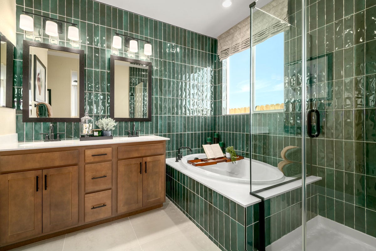 Tub and separate shower with a custom tile surround at primary bath