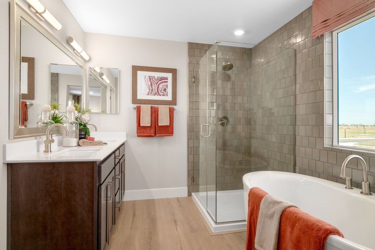 Tub and separate shower with custom tile surround at primary bath