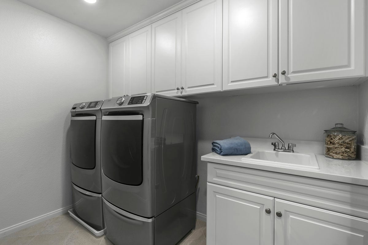 Upgraded laundry sink and cabinets