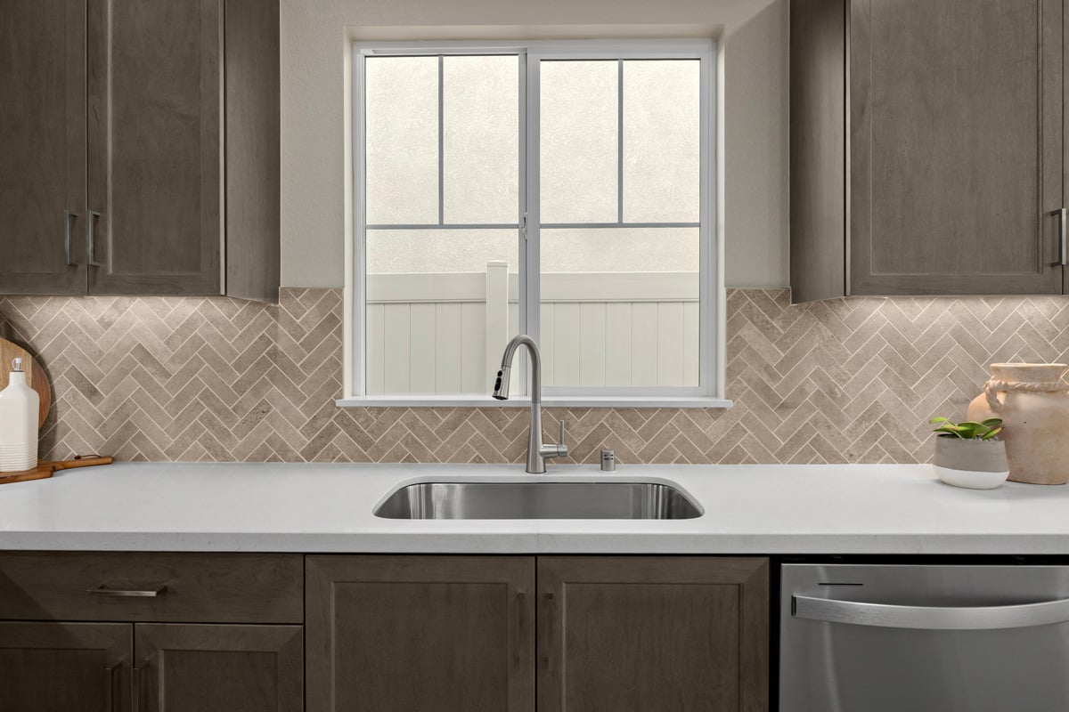 Optional custom tile backsplash at kitchen