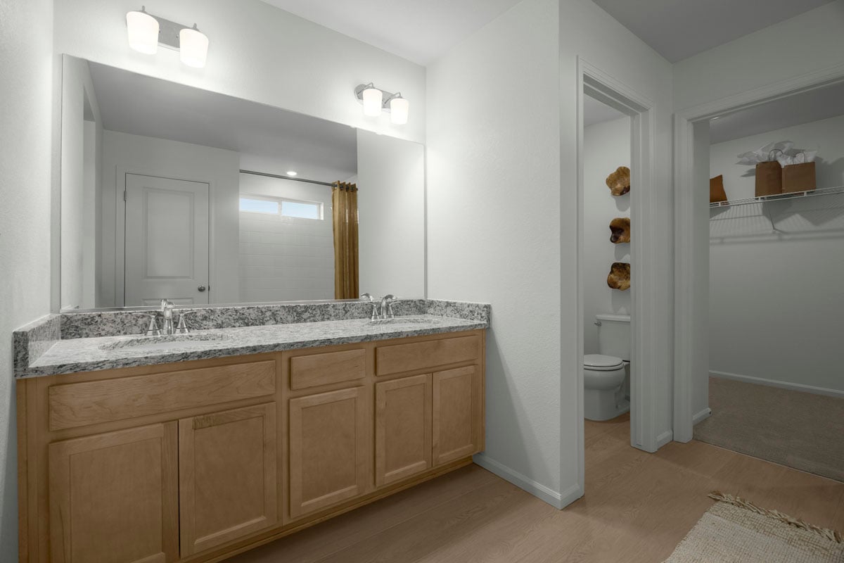 Dual-sink vanity at primary bathroom