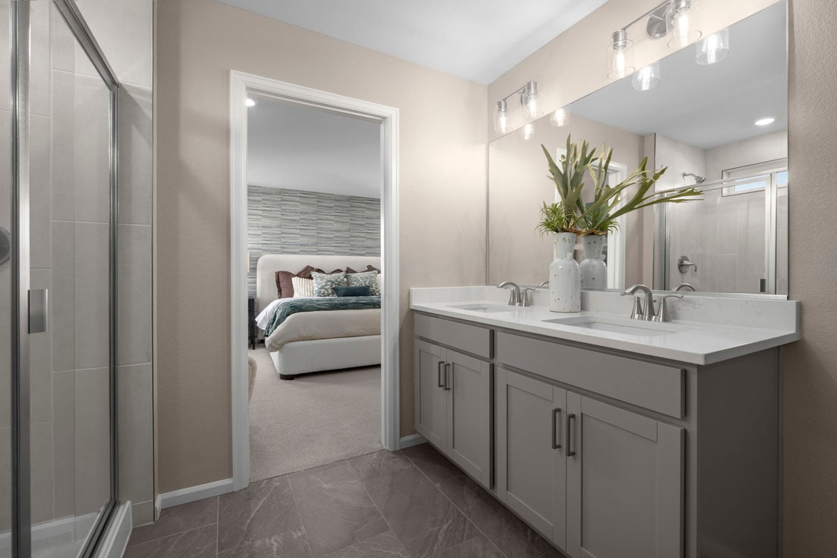 Dual-sink vanity at primary bathroom