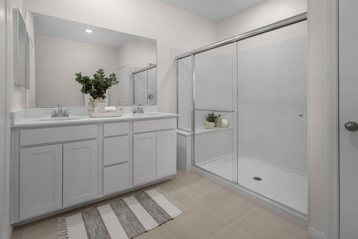 Large walk-in shower with seat at primary bath
