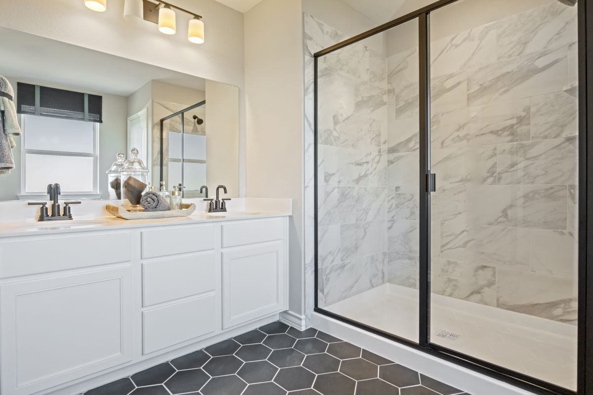 Optional fiberglass shower with tile surround at primary bath