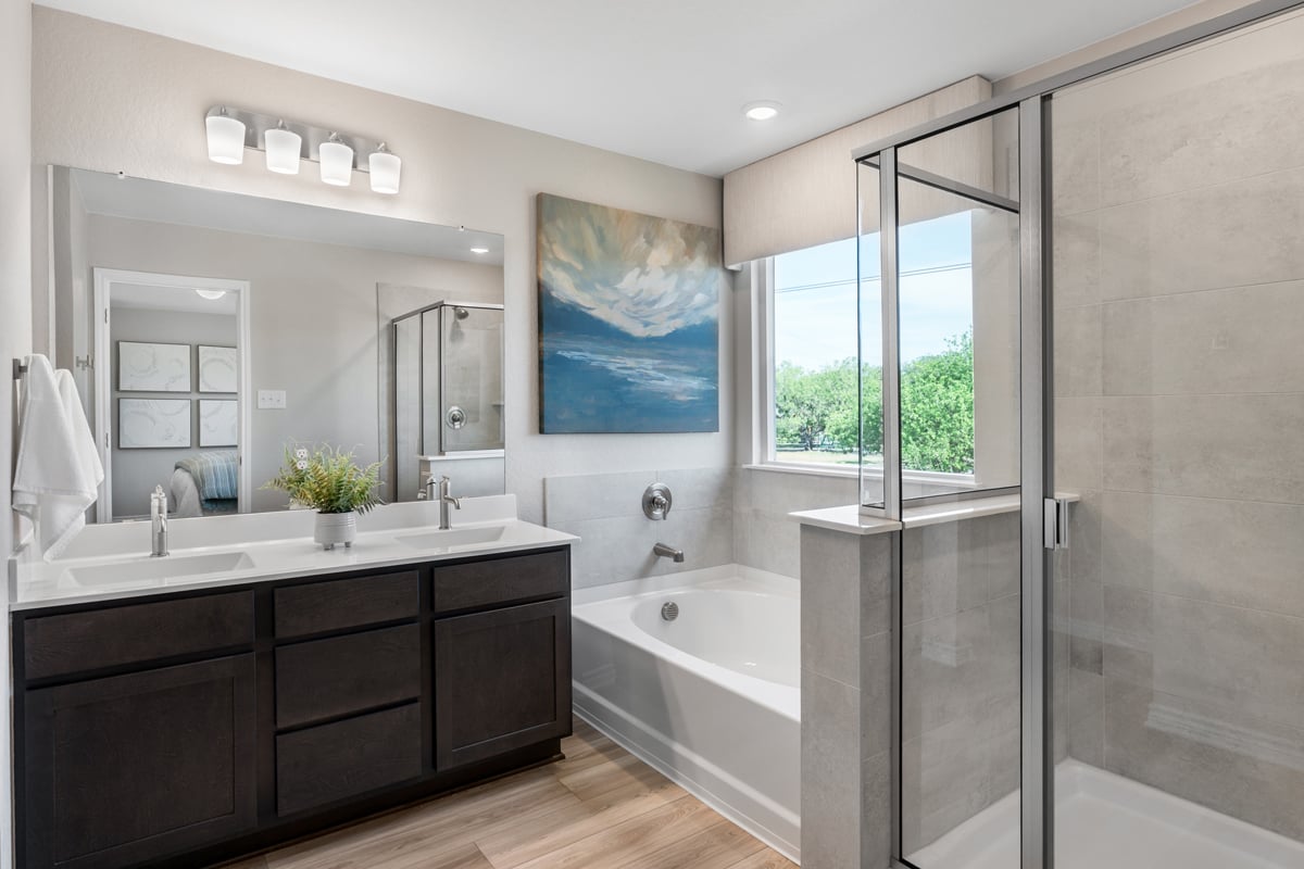 Optional garden tub and separate shower with tile surround at primary bath