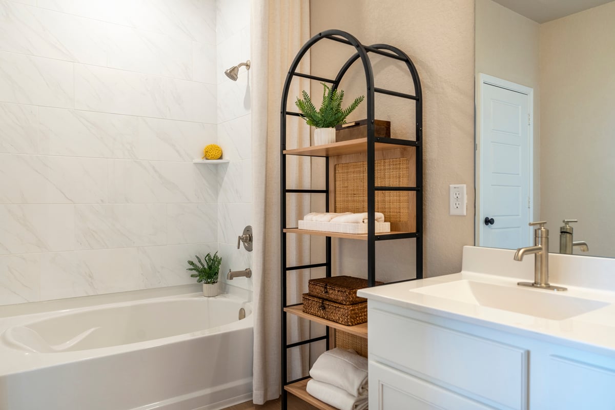 Garden tub with tile surround at primary bath