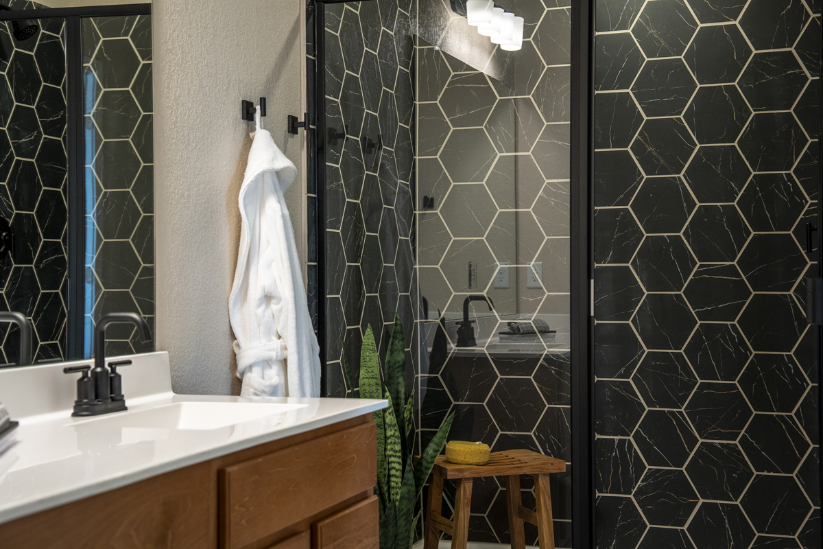 Walk-in shower with hexagon tile surround at bath 2