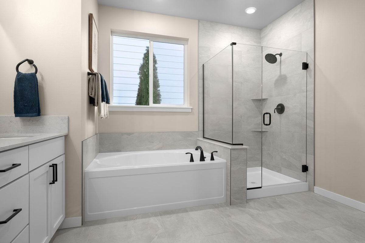 Tub and separate walk-in shower at primary bath