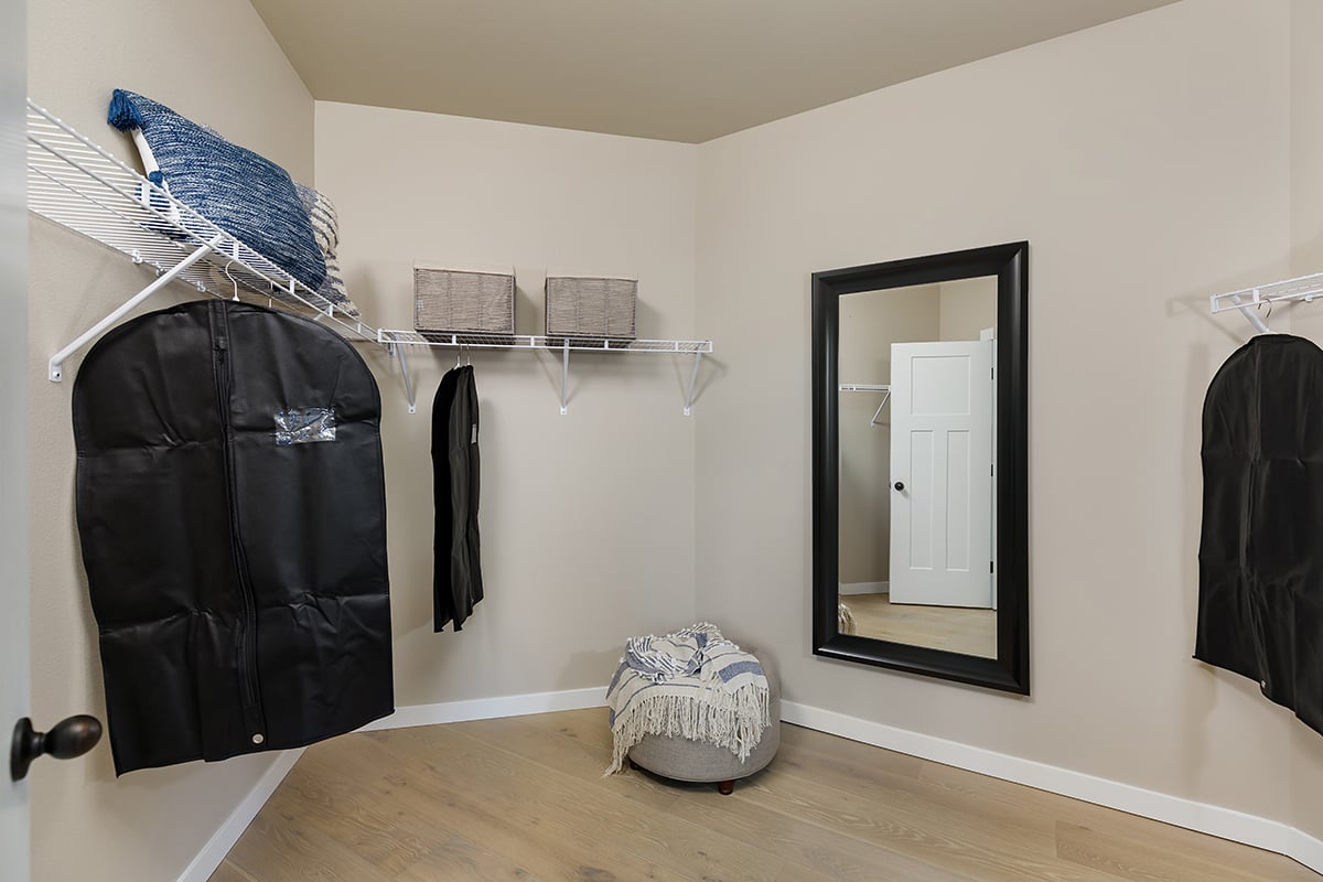 Walk-in closet at primary bedroom